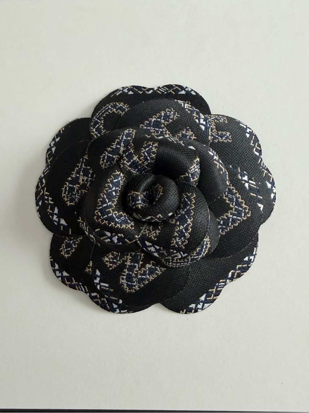 CHANEL Black Fabric Camellia with White and Gold Accents